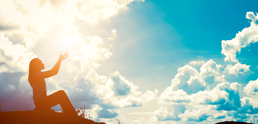 Sunrise woman praying